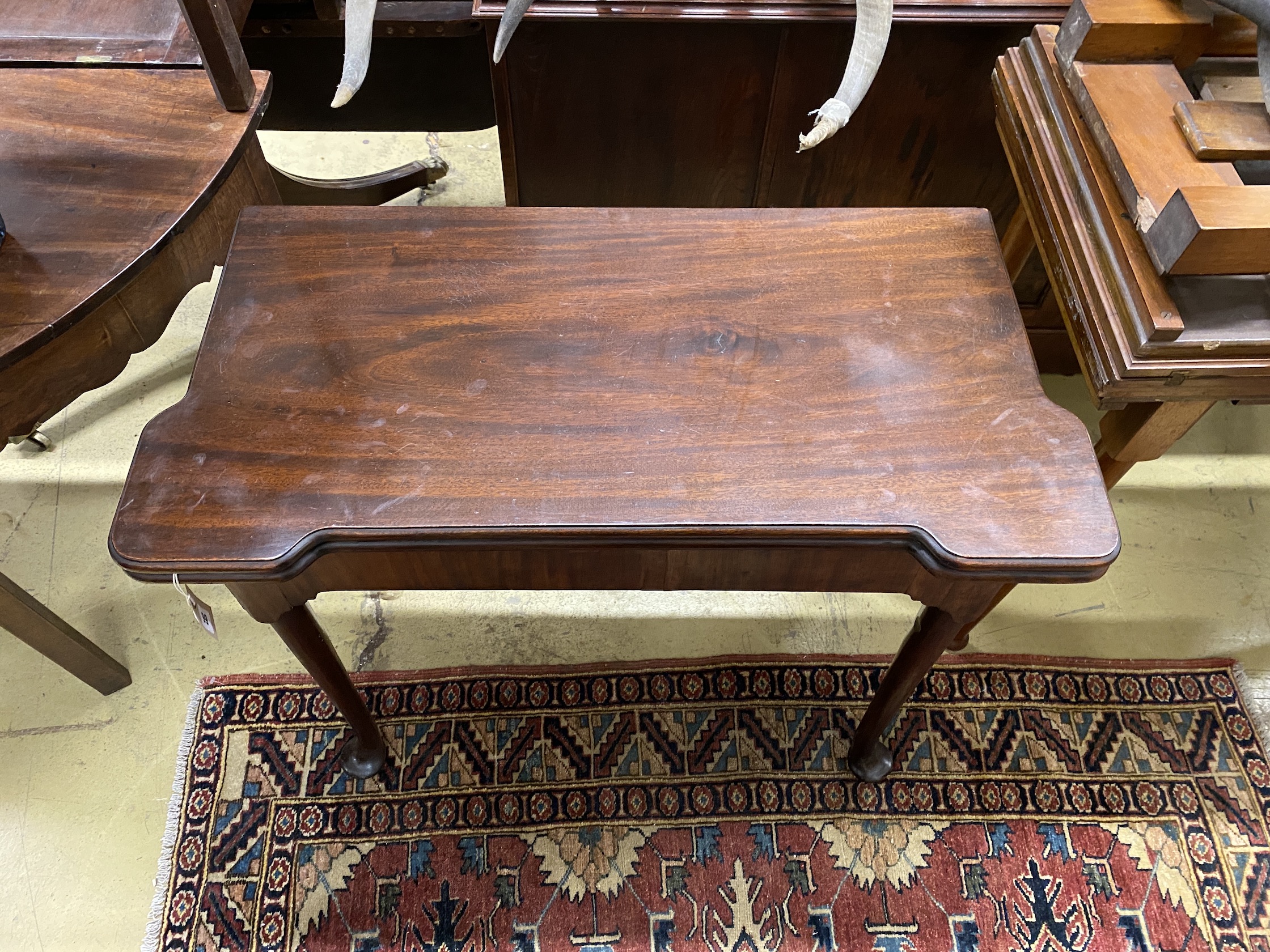 A George III rectangular mahogany folding card table, width 84cm, depth 42cm, height 71cm